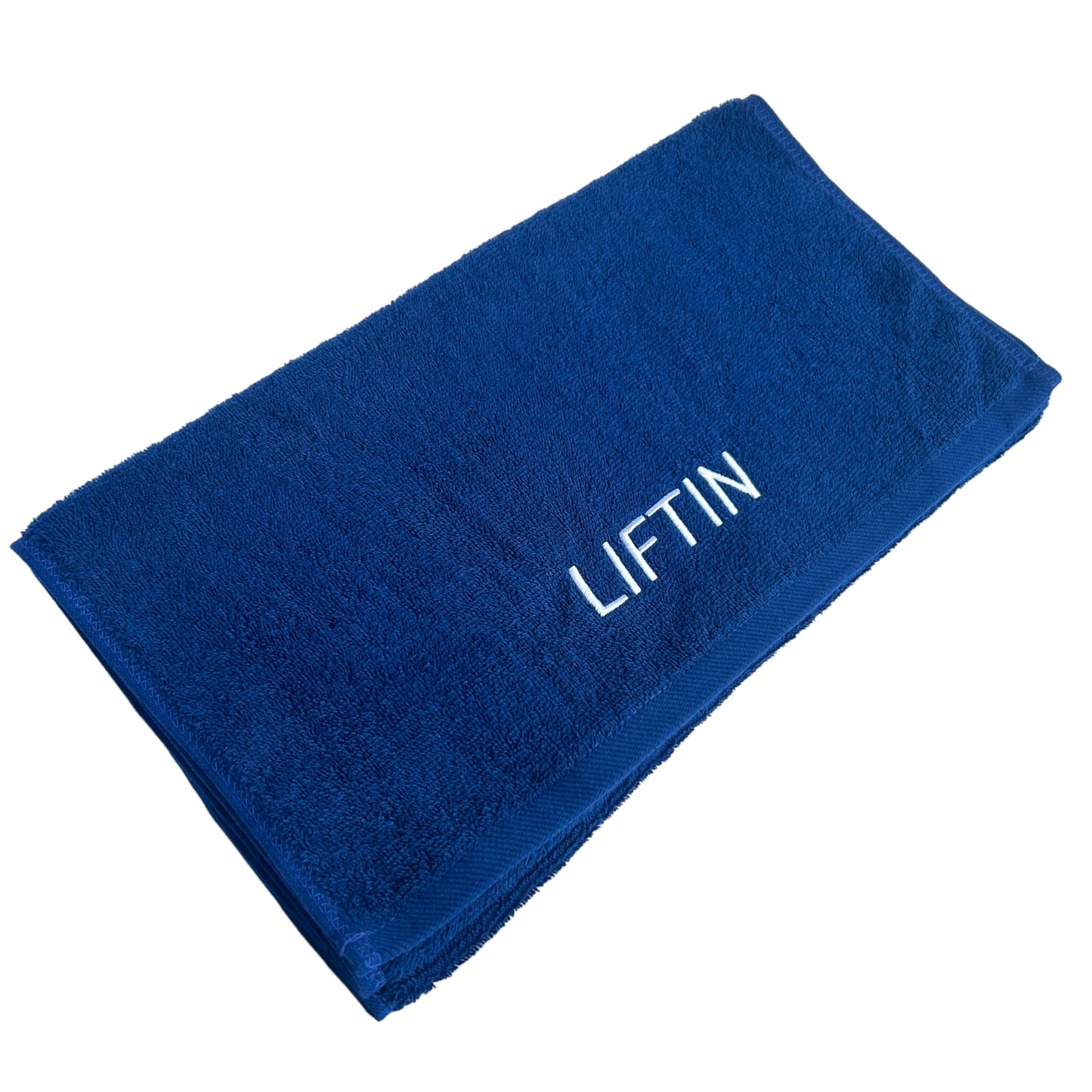 Close-up van het hoogwaardige katoenen materiaal van de LIFTIN sporthanddoek - zacht en ademend